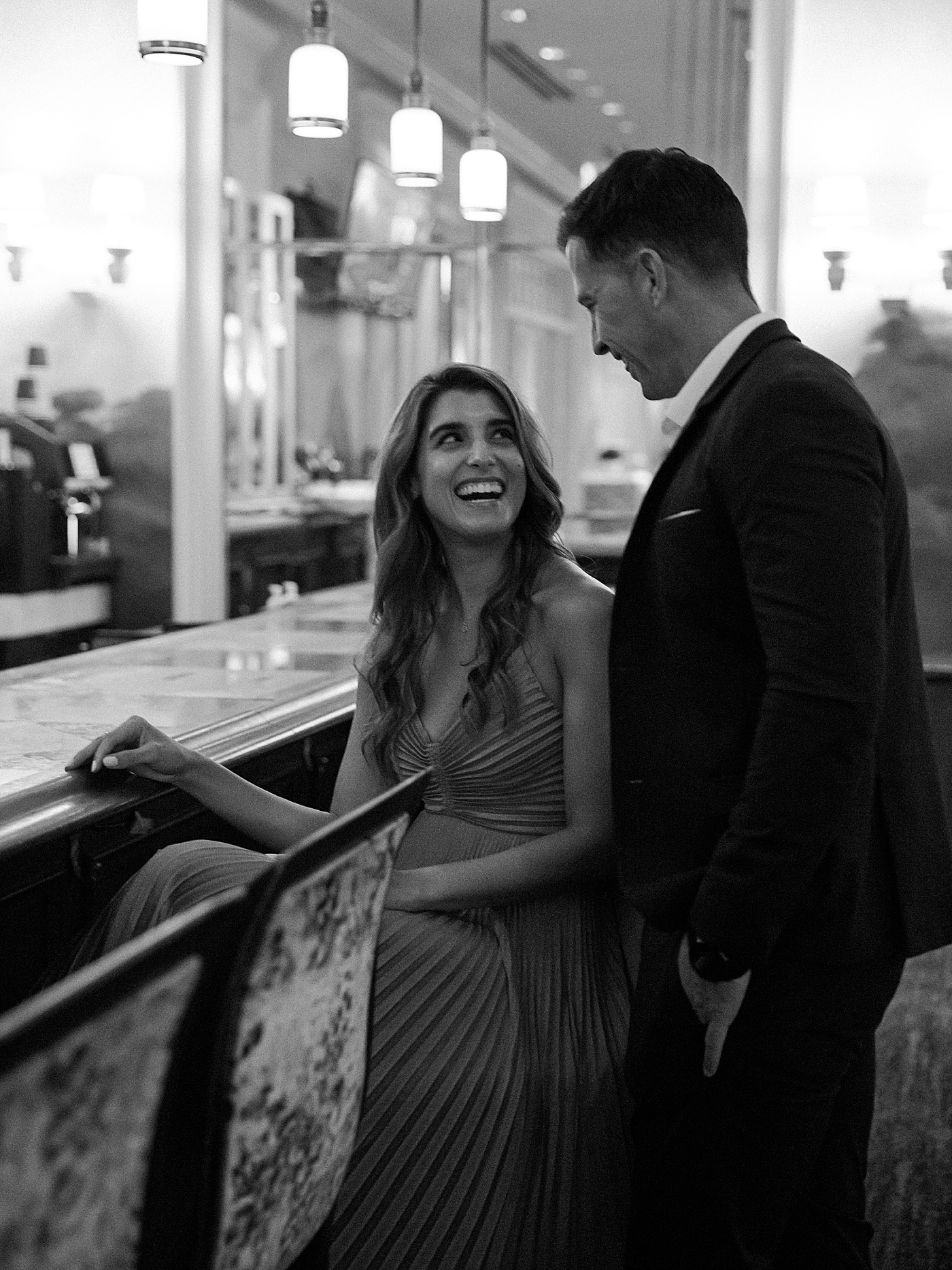 Couple laughing at a bar at the fairmont | Photo by Diane Sotero