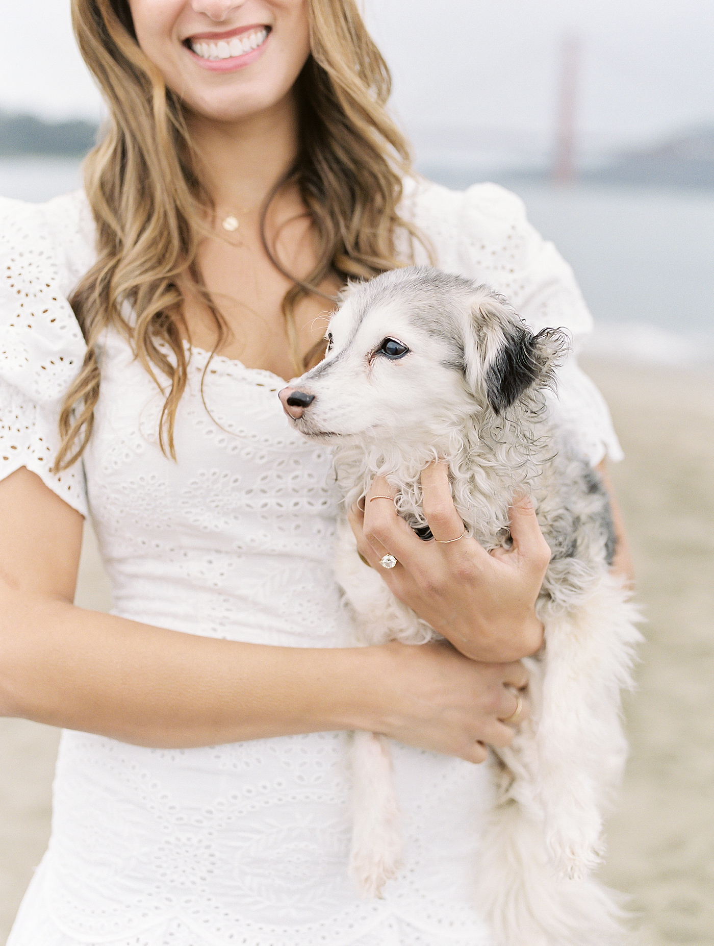 Bride to be holding her dog during her San Francisco engagement session | Photo by Diane Sotero
