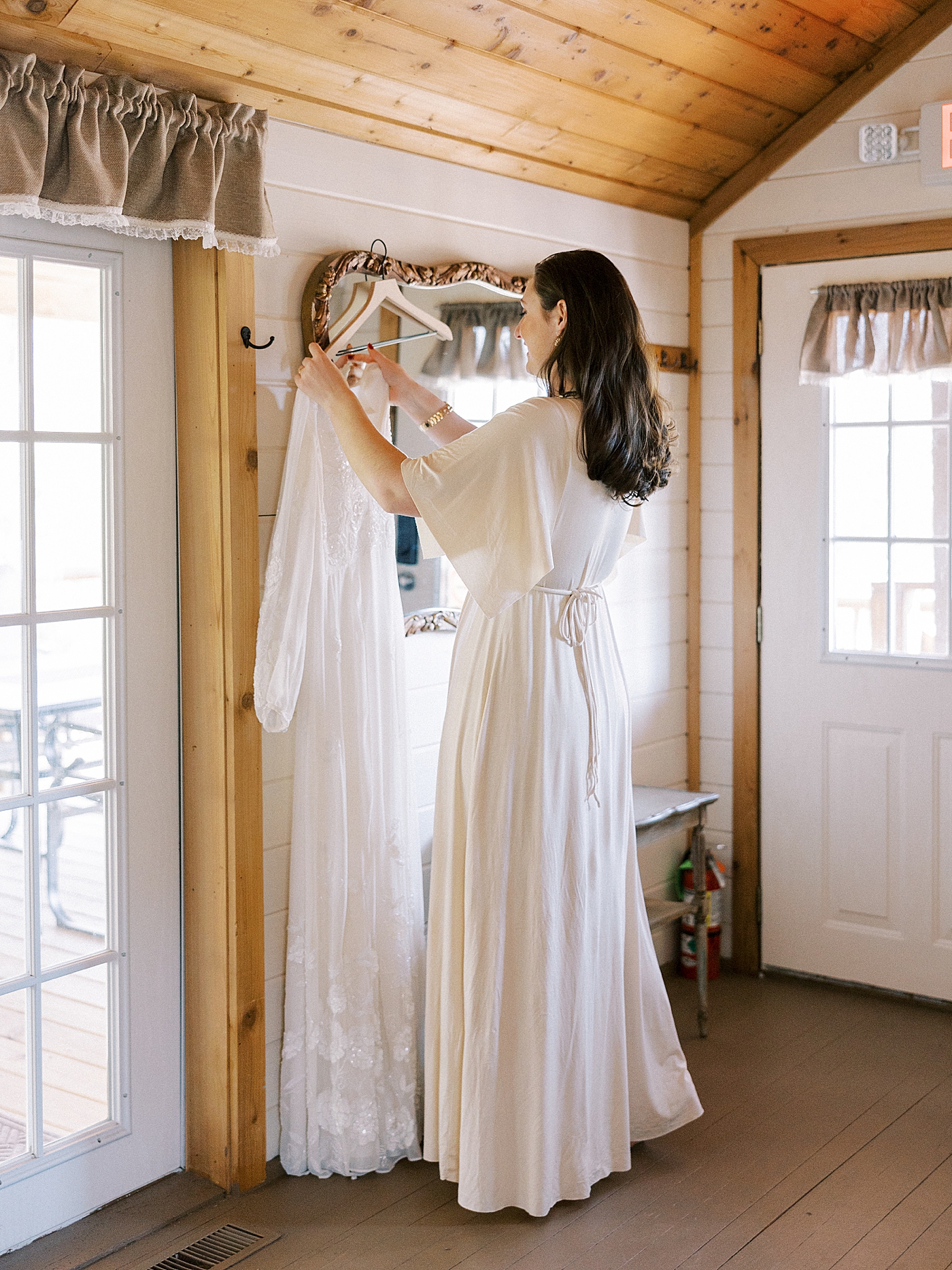 Bride getting her gown ready | Photo by Diane Sotero Photography