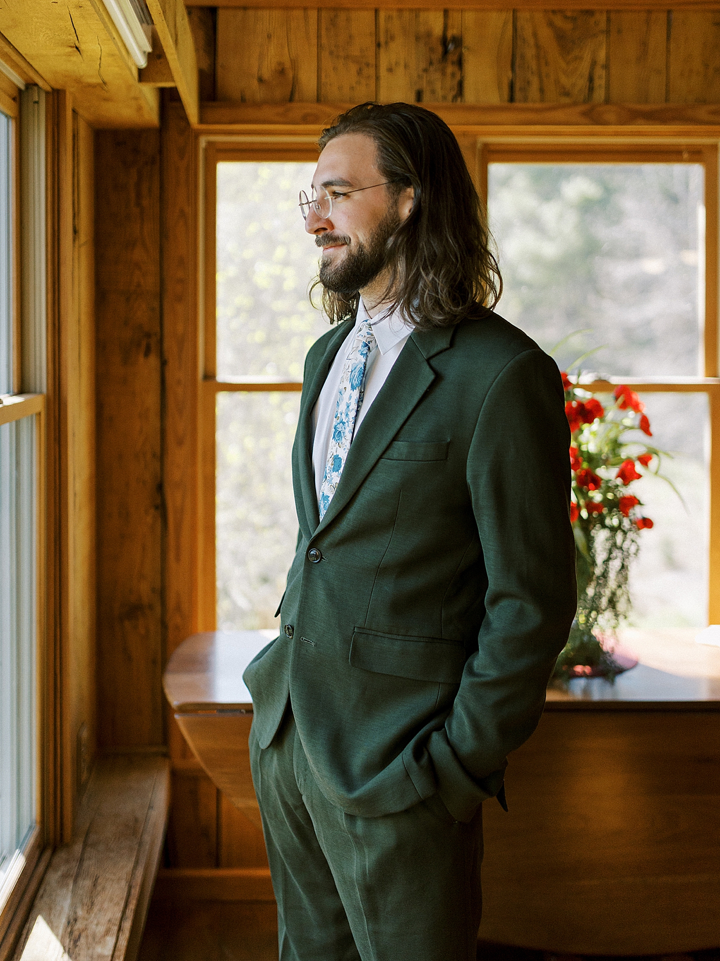 Portrait of groom looking out the window before his North Carolina Wedding | Photo by Diane Sotero Photography