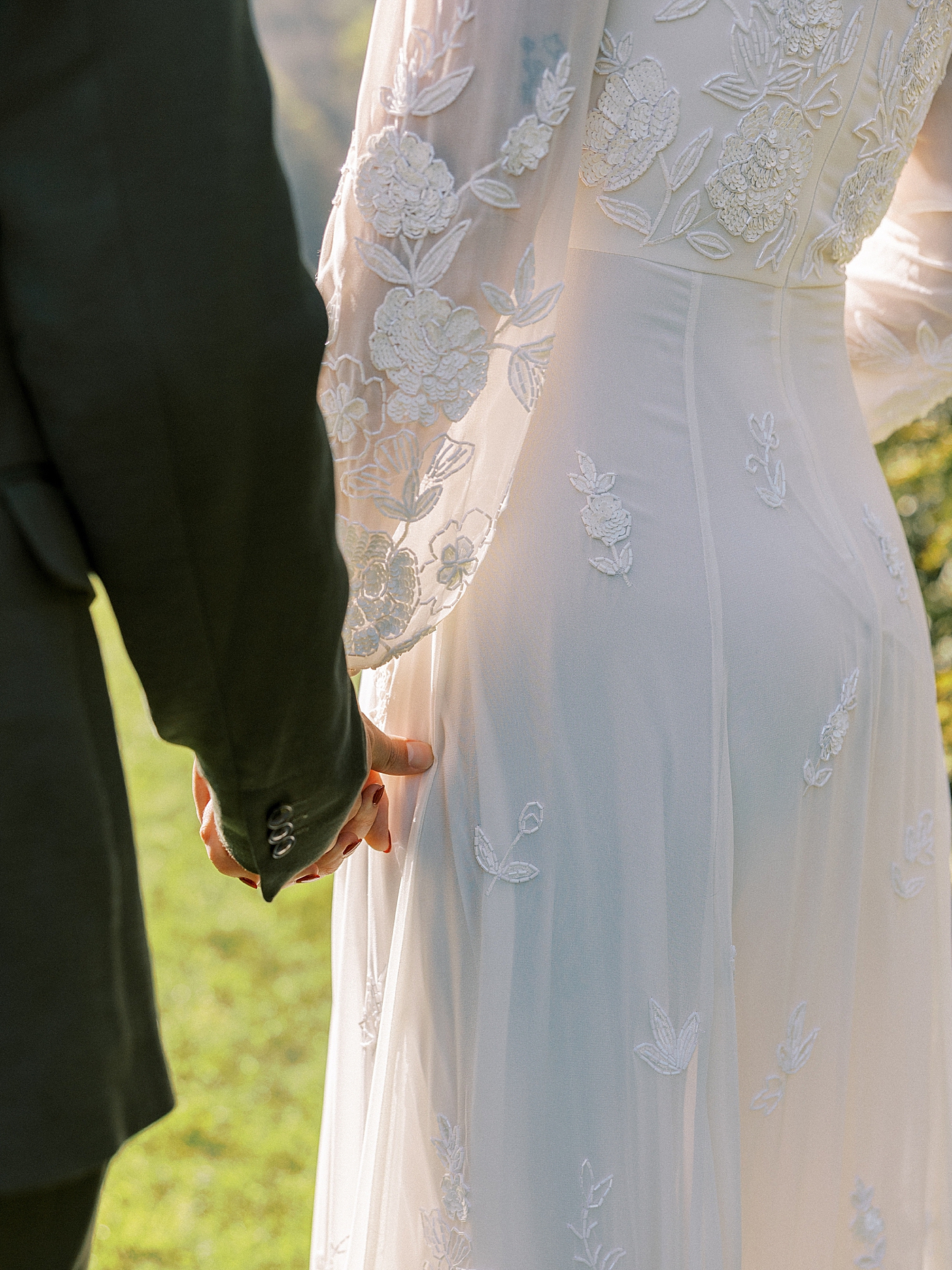Detail of bride and groom holding hands before their North Carolina Wedding | Photo by Diane Sotero Photography