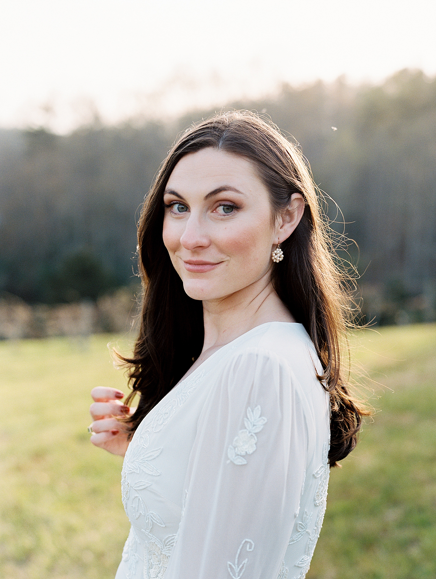 Bride smiling for a portrait after her North Carolina Wedding | Photo by Diane Sotero Photography