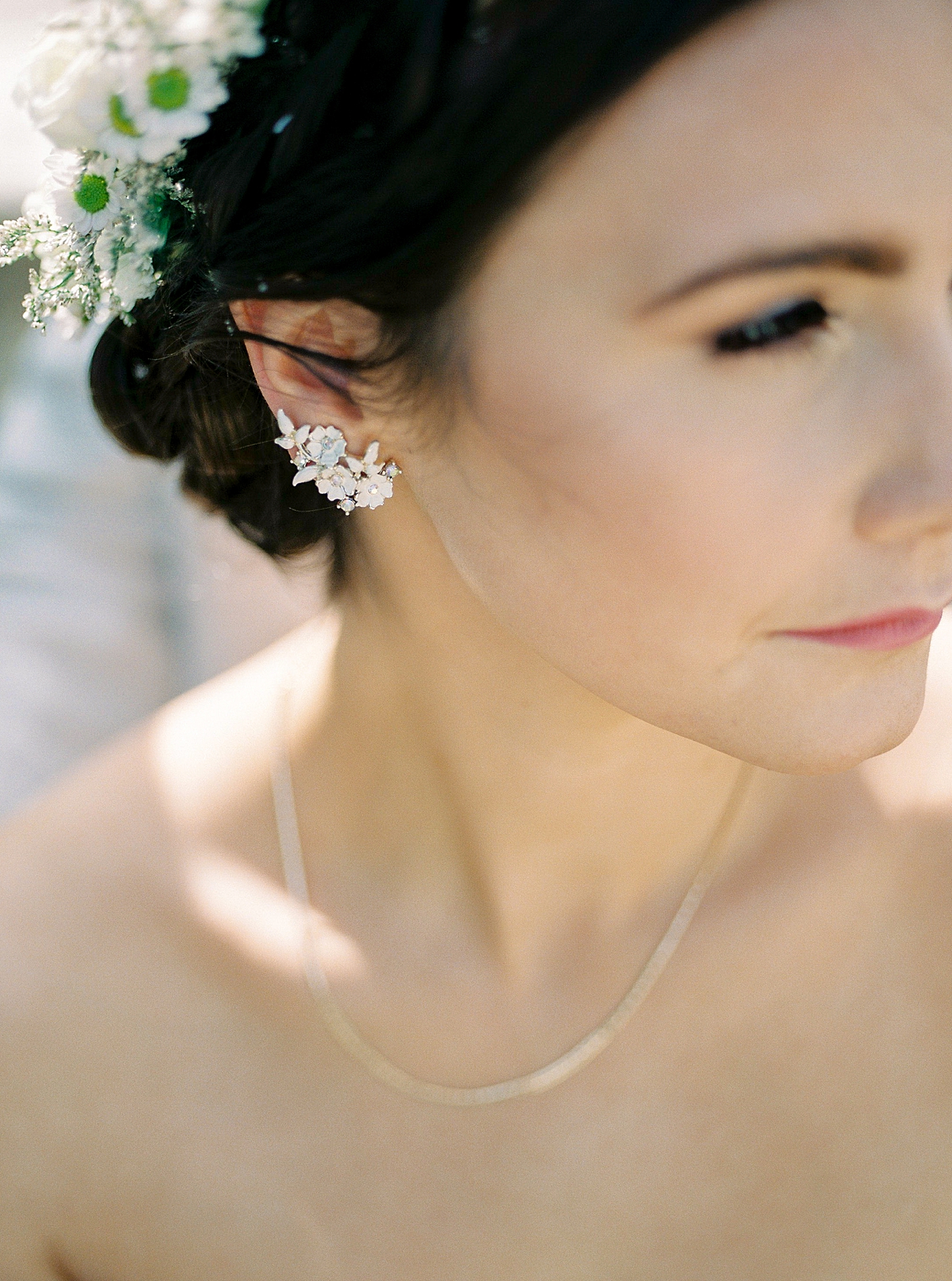 Detail of bride to be's earrings and flower crown | Photo by Diane Sotero 