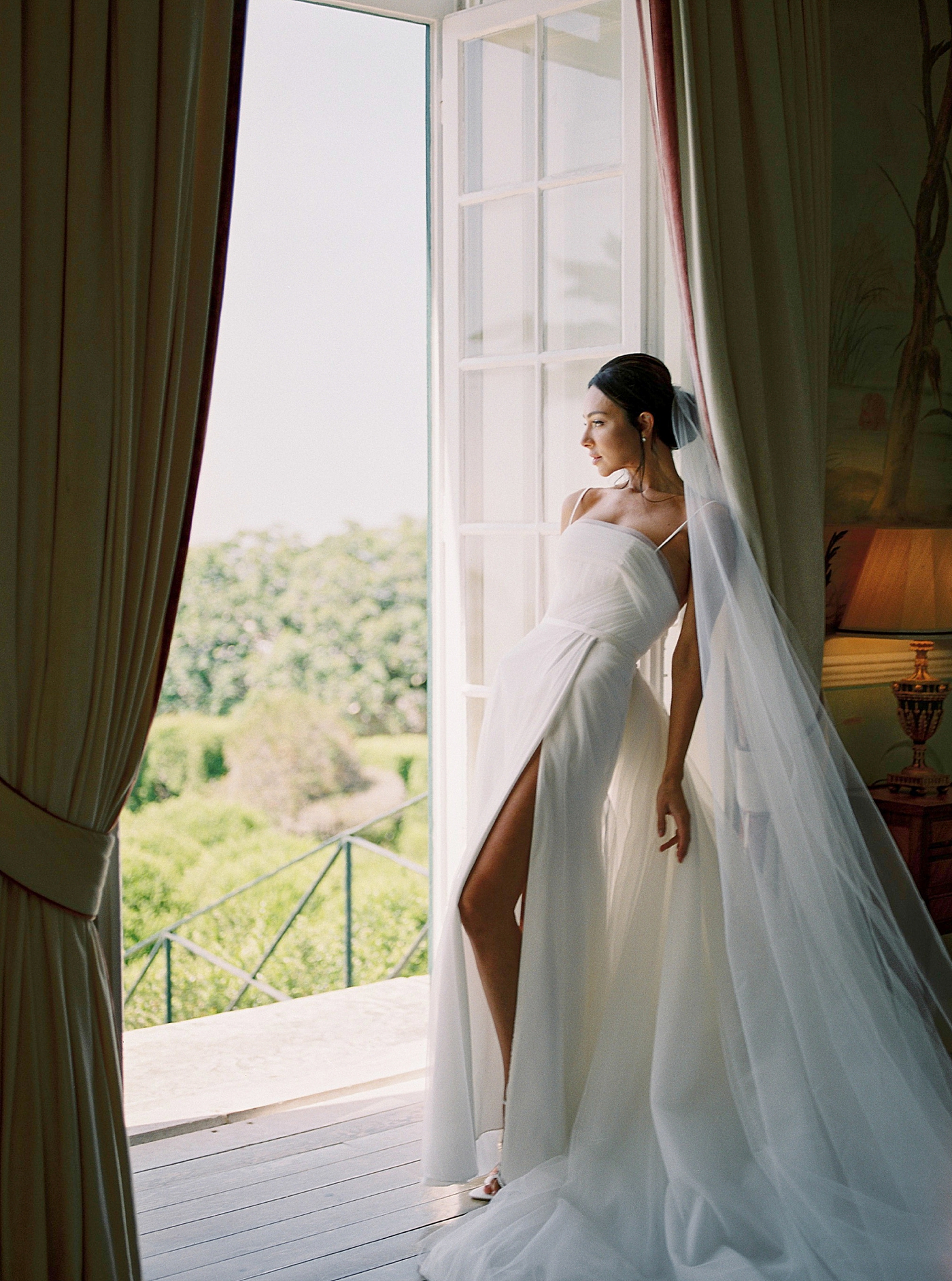 Bride standing near a door | Image by Diane Sotero Photography
