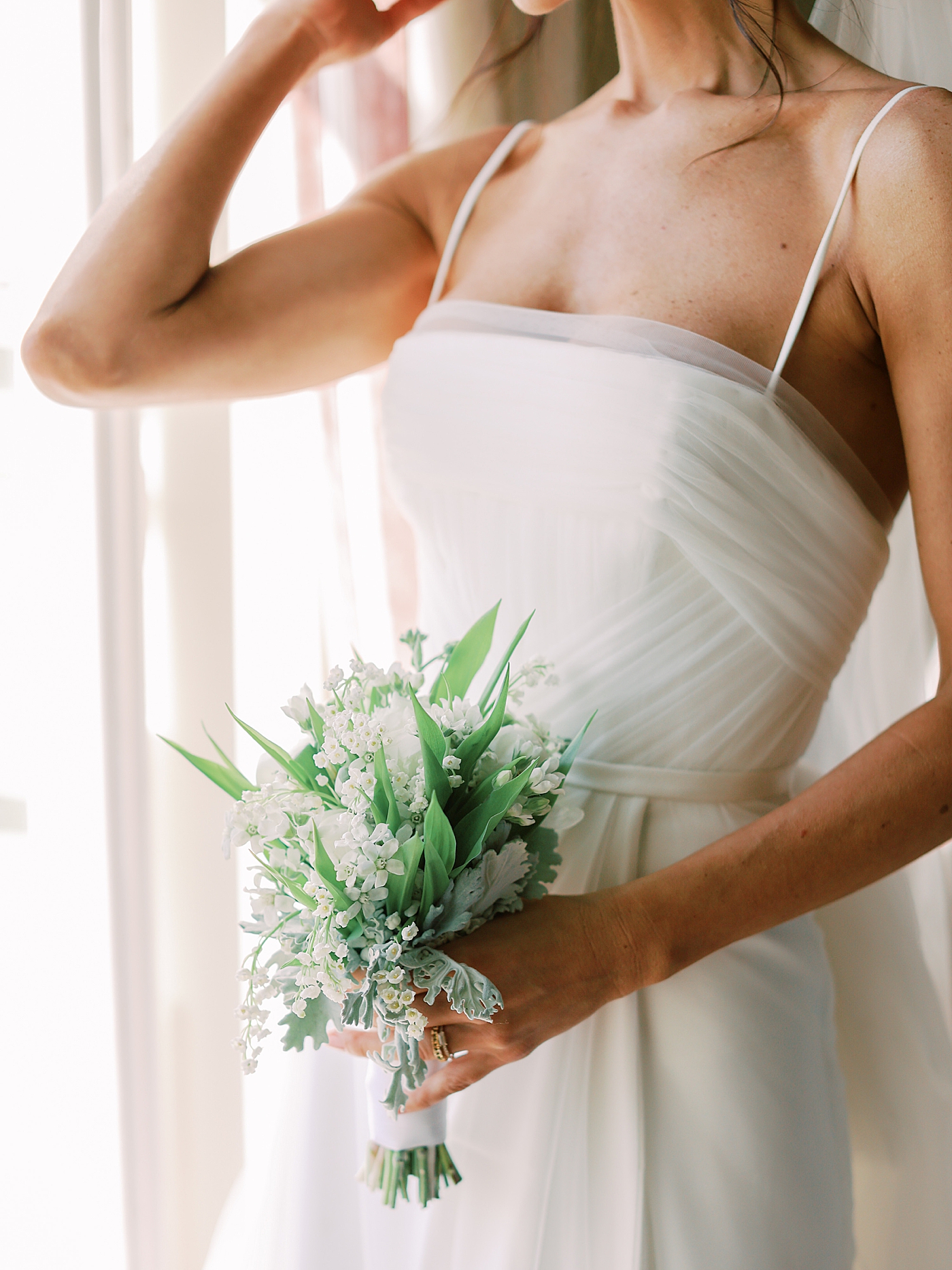 Detail of bridal bouquet held by bride | Image by Diane Sotero Photography
