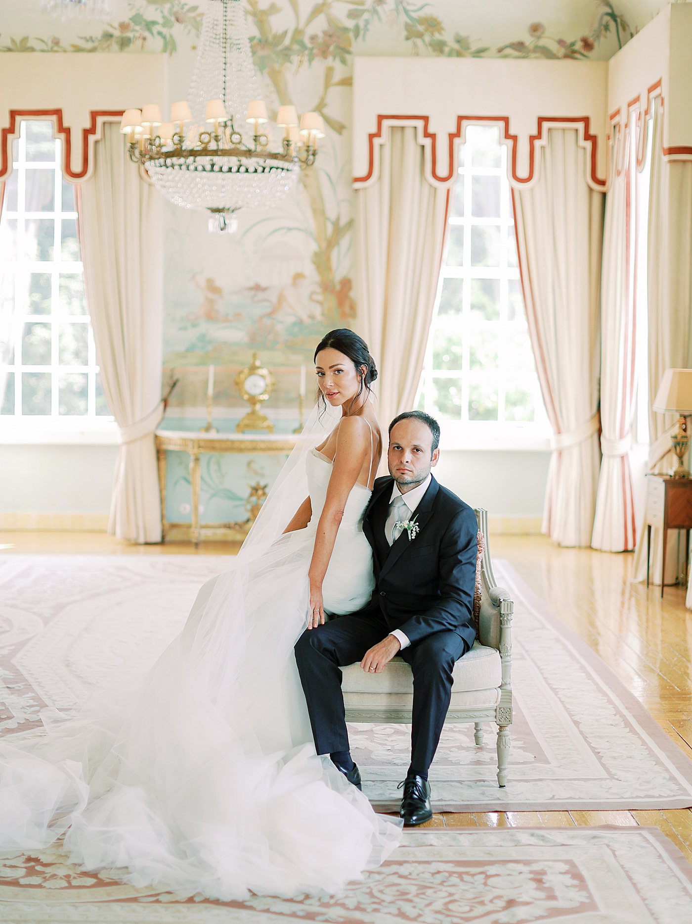 Bride and groom sitting on a chair | Image by Diane Sotero Photography