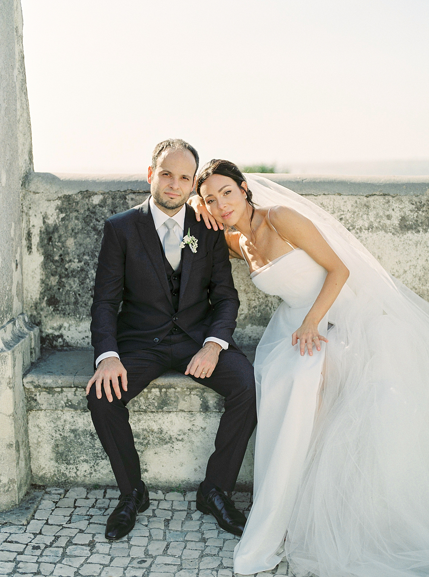 Bride leaning on groom shoulder after their Palácio de Seteais Elopement | Image by Diane Sotero Photography