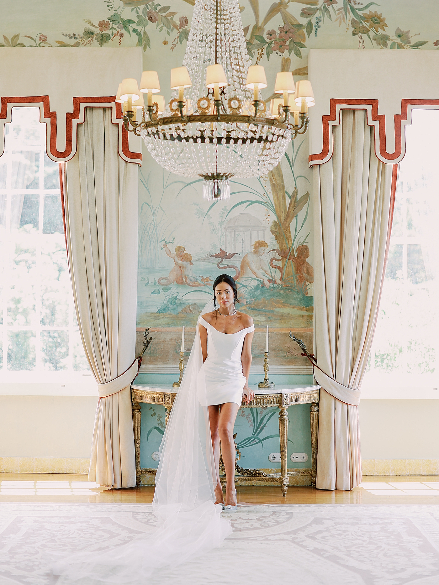 Bride in a reception dress in an elaborately decorated room | Image by Diane Sotero Photography