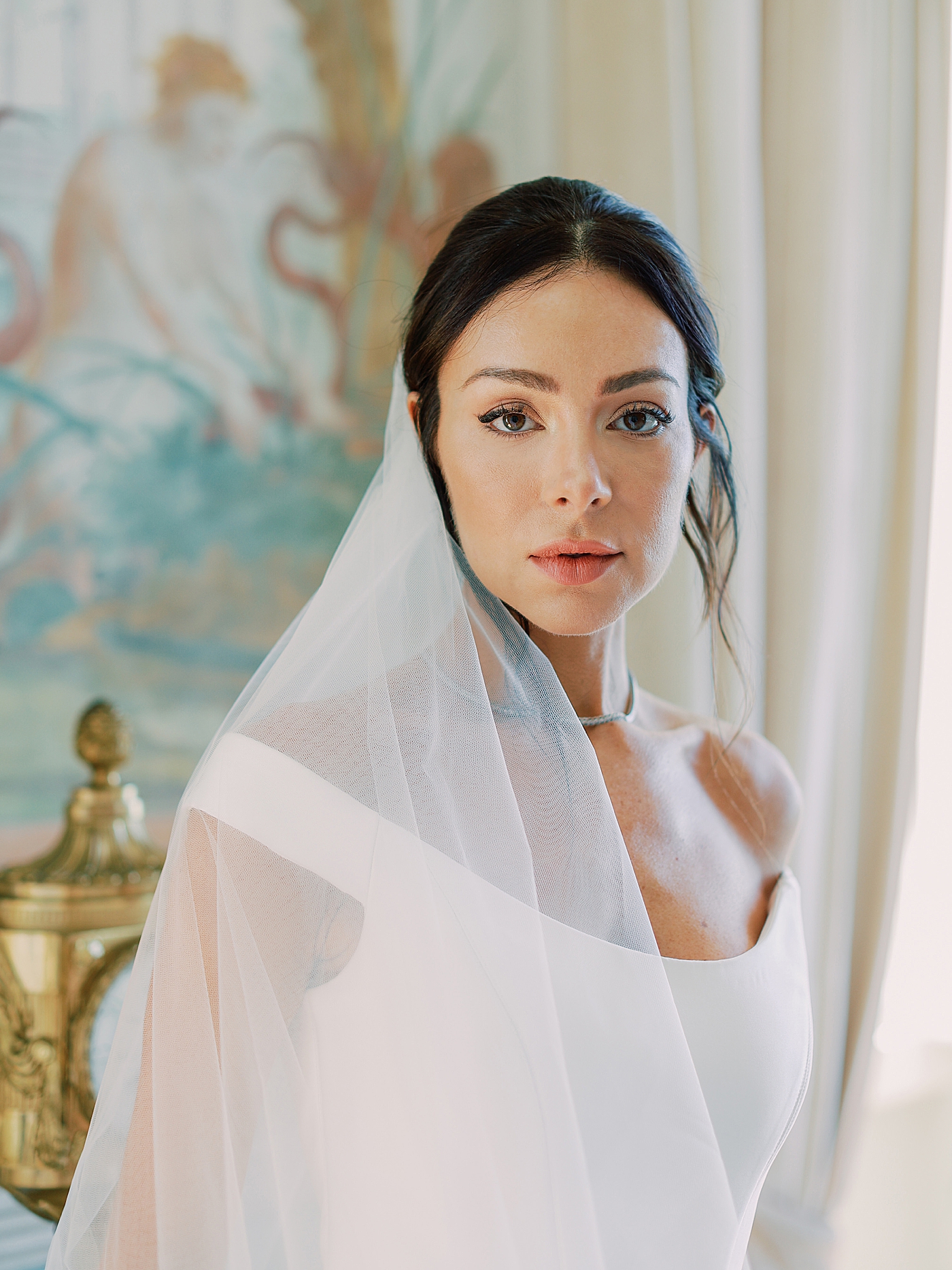 Portrait of a bride with an off the shoulder dress and veil | Image by Diane Sotero Photography