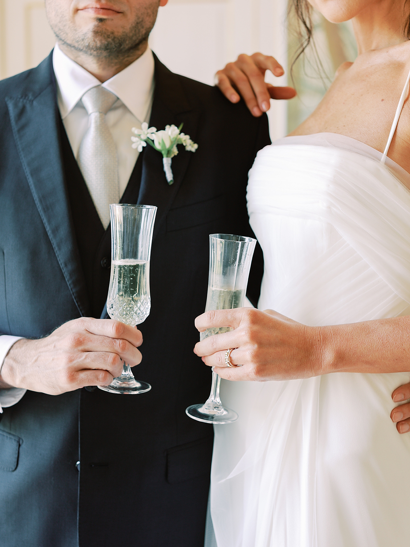 Detail of bride and groom champagne glasses | Image by Diane Sotero Photography