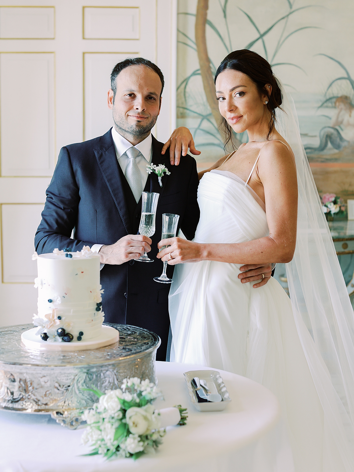 Bride and groom toasting champagne | Image by Diane Sotero Photography