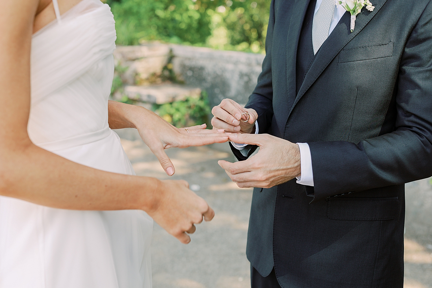 Bride and groom exchanging rings | Photo by Diane Sotero Photography