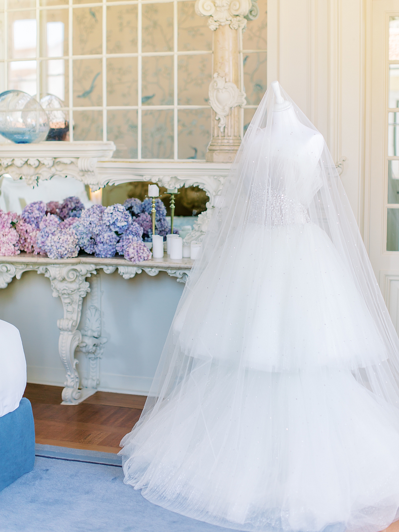 Couture bridal down on a mannequin in the bride's getting ready room | Image by Diane Sotero 