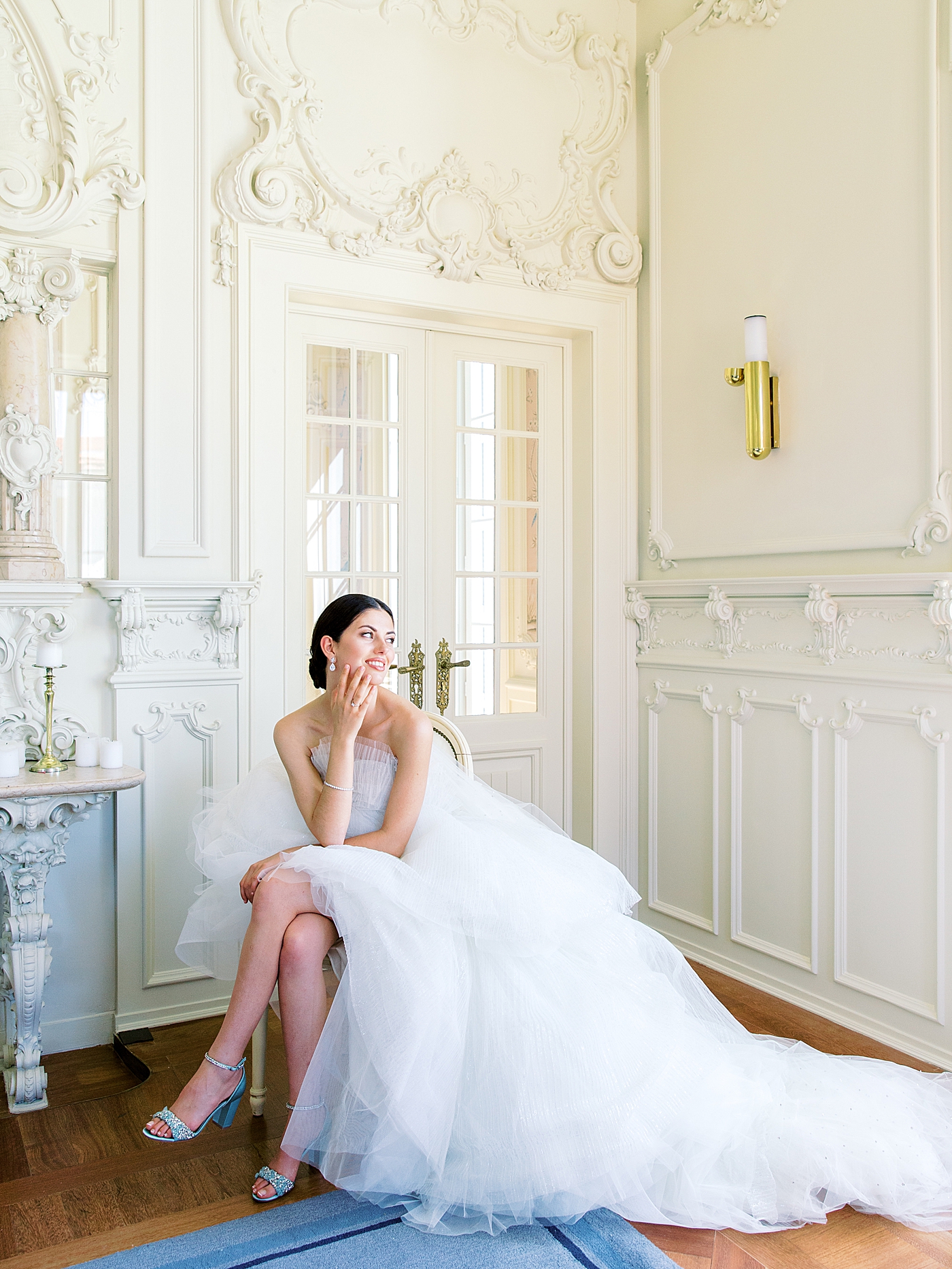 Bride with light blue shoes during bridal portraits in her getting ready room | Image by Diane Sotero 